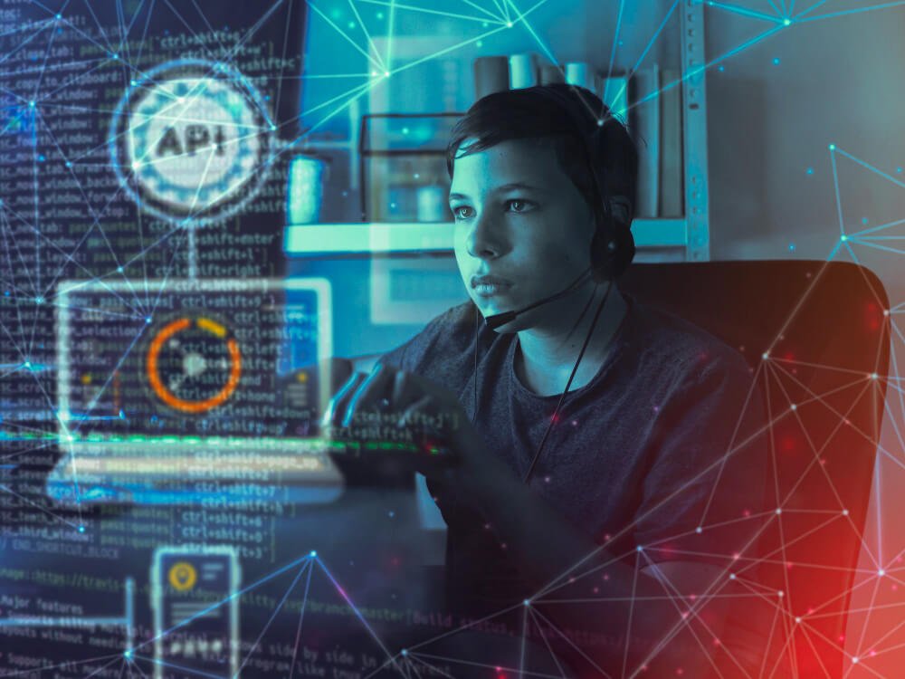 A man with headset sitting in front of a holographic screen. 