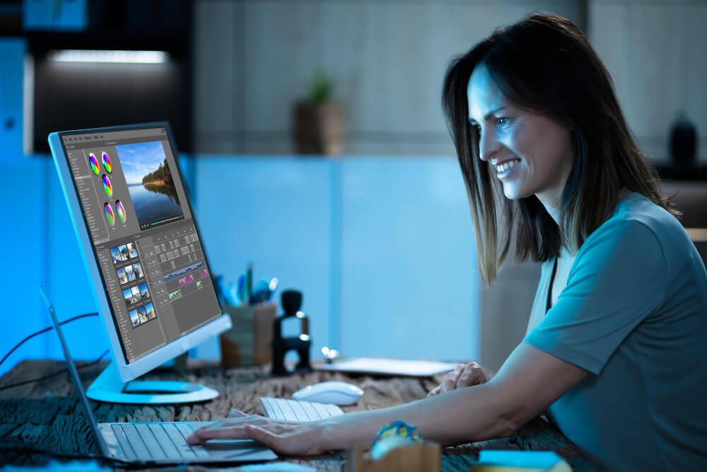 A female animator using  AI tools on her desktop.